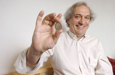 Persi Diaconis holding a coin